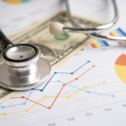 stethoscope with graphs and currency_canstockphoto100865763 800x533