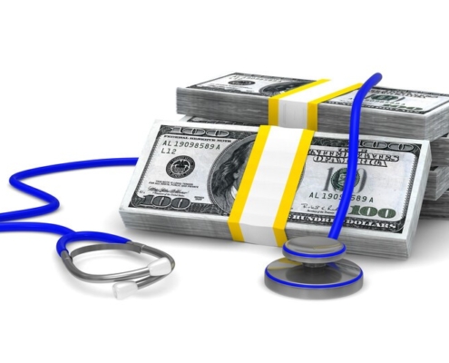 stacks of money with stethoscope_canstockphoto13656167-3
