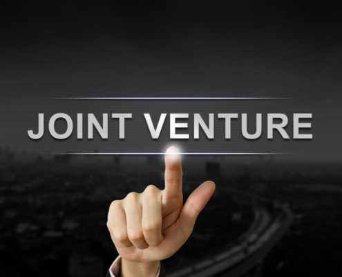 finger pointing at words joint venture_canstockphoto42416008-2 800x533