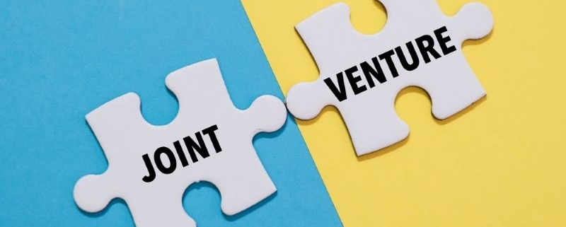 joint venture graphic_JOINT VENTURE word alphabet letters on puzzle_shutterstock_2500442725 800x533
